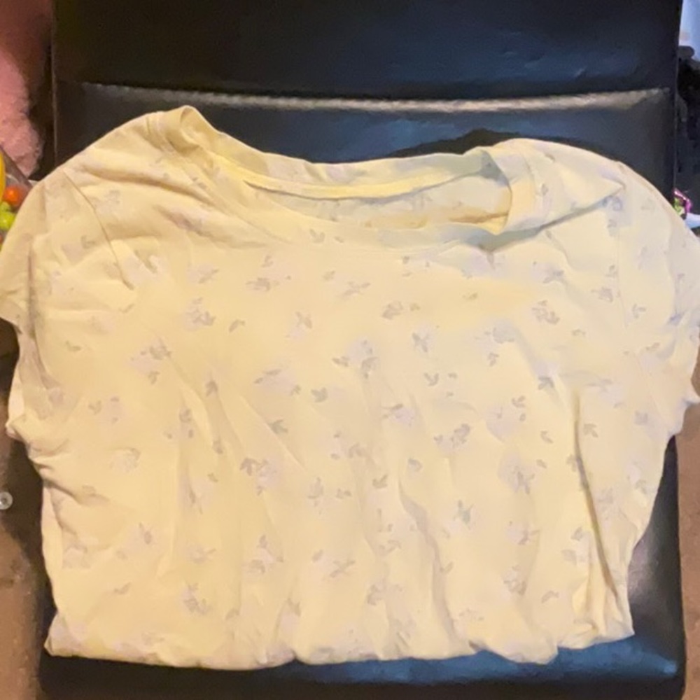 Yellow top with white flowers